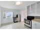 Bright kitchen featuring stainless steel appliances, tiled floors, and white cabinets, offering a clean and modern feel at 6305 Bass Hwy, St Cloud, FL 34771