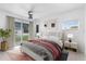 Stylishly staged main bedroom with a sliding door leading to backyard view at 6305 Bass Hwy, St Cloud, FL 34771