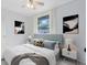 Bright main bedroom featuring a comfortable bed, stylish decor, and soft natural light at 6305 Bass Hwy, St Cloud, FL 34771