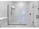 Stylish bathroom featuring a large glass shower with rainfall shower head and white-marble-patterned tile at 6439 Trailblaze Bnd, St Cloud, FL 34771