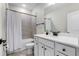 Bright bathroom features vanity with sink, shower with light tile, and toilet at 6439 Trailblaze Bnd, St Cloud, FL 34771