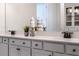 Bright bathroom featuring double vanity, decorative accents, and ample cabinet space at 6439 Trailblaze Bnd, St Cloud, FL 34771