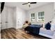 Bright bedroom with accent chair and ensuite bathroom at 6439 Trailblaze Bnd, St Cloud, FL 34771
