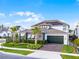 Attractive home with lush landscaping, well-maintained lawn, and a paver driveway adding to its charm at 6439 Trailblaze Bnd, St Cloud, FL 34771