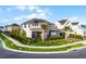 Beautifully landscaped home with a manicured lawn and a charming exterior, showcasing curb appeal at 6439 Trailblaze Bnd, St Cloud, FL 34771