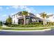 A modern two-story home with professionally landscaped front yard, dark garage door, and elegant black trim at 6439 Trailblaze Bnd, St Cloud, FL 34771
