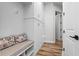 Hallway featuring a built-in seating area with storage, and a wall of closets at 6439 Trailblaze Bnd, St Cloud, FL 34771