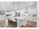 Modern kitchen featuring a large island with bar seating, stainless steel appliances, and ample counter space at 6439 Trailblaze Bnd, St Cloud, FL 34771