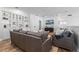 Bright living room features built-in shelving, comfortable seating, and a mounted TV at 6439 Trailblaze Bnd, St Cloud, FL 34771