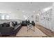 Second floor living room with couches, built in shelving, and lots of natural light at 6439 Trailblaze Bnd, St Cloud, FL 34771
