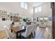 Bright living and dining area featuring hardwood floors and soaring ceilings with abundant natural light at 6439 Trailblaze Bnd, St Cloud, FL 34771