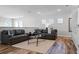 Upstairs living room with couches, accent tables, and lots of natural light at 6439 Trailblaze Bnd, St Cloud, FL 34771