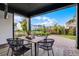 View of covered outdoor patio with dining table and view of backyard at 6439 Trailblaze Bnd, St Cloud, FL 34771