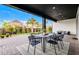 Covered patio features outdoor dining table at 6439 Trailblaze Bnd, St Cloud, FL 34771