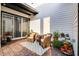 A cozy outdoor patio with brick pavers, wicker seating, and potted plants creating a serene setting at 6439 Trailblaze Bnd, St Cloud, FL 34771