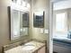 Well-lit bathroom featuring a granite countertop vanity and modern fixtures at 6575 Time Square Ave # 101, Orlando, FL 32835