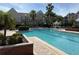 Large community pool with ample seating and a gazebo; perfect for relaxation at 6575 Time Square Ave # 101, Orlando, FL 32835