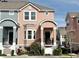 Charming two-story townhome with a front porch and meticulously maintained landscaping at 6575 Time Square Ave # 101, Orlando, FL 32835