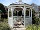 Relaxing gazebo in a landscaped garden setting with seating, providing a tranquil outdoor space at 6575 Time Square Ave # 101, Orlando, FL 32835