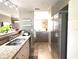 Kitchen with a breakfast bar and stainless steel appliances, offering open concept living at 6575 Time Square Ave # 101, Orlando, FL 32835