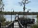 A serene pier over the lake with a covered gazebo; perfect for enjoying nature at 6575 Time Square Ave # 101, Orlando, FL 32835