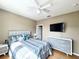 Serene primary bedroom with a ceiling fan, neutral tones, and ample natural light at 6575 Time Square Ave # 101, Orlando, FL 32835