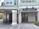 Exterior of the Teak Neighborhood Grill with signage and outdoor seating at 6575 Time Square Ave # 101, Orlando, FL 32835