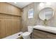 Modern bathroom featuring a stylish vanity, toilet, and a sleek glass-enclosed shower with elegant tile work at 7320 Fieldcrest Ave, Winter Park, FL 32792