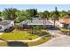 Well-maintained single-story home featuring lush landscaping and a welcoming front lawn at 7320 Fieldcrest Ave, Winter Park, FL 32792
