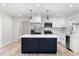 Bright kitchen with an island, stainless steel appliances, and white marble subway tile at 7320 Fieldcrest Ave, Winter Park, FL 32792