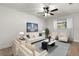 Bright and airy living room featuring a modern sofa, armchairs, and stylish decor at 7320 Fieldcrest Ave, Winter Park, FL 32792