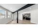 Bright living room showcasing an open floor plan with an island kitchen and wood flooring at 7320 Fieldcrest Ave, Winter Park, FL 32792