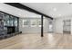 Spacious living room with a modern fireplace, hardwood floors, and open concept design at 7320 Fieldcrest Ave, Winter Park, FL 32792