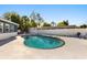 Backyard pool features privacy fence and lounge chairs for relaxing at 7320 Fieldcrest Ave, Winter Park, FL 32792