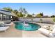 Inviting backyard pool with lounge chairs, and a fun flamingo float, perfect for relaxation and outdoor enjoyment at 7320 Fieldcrest Ave, Winter Park, FL 32792
