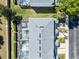 Aerial view showcasing a property's roof, screened-in pools, and lush backyard at 7666 Sir Kaufmann Ct, Kissimmee, FL 34747