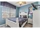 Comfortable bedroom featuring a queen-sized bed, and large window offering plenty of natural light at 7666 Sir Kaufmann Ct, Kissimmee, FL 34747
