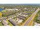 An aerial view displays the exteriors of townhomes and their surrounding landscape in a quiet neighborhood at 10124 Shadow Leaf Ct, Orlando, FL 32825