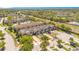 Aerial view of townhome community with lush landscaping at 10124 Shadow Leaf Ct, Orlando, FL 32825