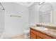 Bathroom features a wood vanity with sink and mirror plus a tile shower at 10124 Shadow Leaf Ct, Orlando, FL 32825