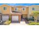 Townhome features a two-car garage and welcoming entrance at 10124 Shadow Leaf Ct, Orlando, FL 32825