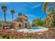 Community pool features a clubhouse, lounge chairs and lush landscaping at 10124 Shadow Leaf Ct, Orlando, FL 32825