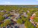 Extensive aerial view of an apartment complex with a pool, tennis court and lush green surroundings at 1013 S Hiawassee Rd # 3628, Orlando, FL 32835