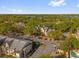 Aerial view of an apartment complex featuring well-maintained grounds, ample parking, and lake views at 1013 S Hiawassee Rd # 3628, Orlando, FL 32835