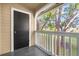 Exterior view of a balcony with a door and wooded landscape at 1013 S Hiawassee Rd # 3628, Orlando, FL 32835