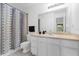 Bathroom featuring decorative shower curtain, sink, and vanity with mirror at 1013 S Hiawassee Rd # 3628, Orlando, FL 32835