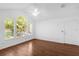 Bedroom with a vaulted ceiling, and large windows showcasing a beautiful view and hardwood floor at 1013 S Hiawassee Rd # 3628, Orlando, FL 32835