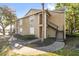 Exterior of a two-story condo featuring well-maintained landscaping and stairs at 1013 S Hiawassee Rd # 3628, Orlando, FL 32835