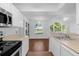 Bright eat-in kitchen with modern appliances and views of the outdoor landscape at 1013 S Hiawassee Rd # 3628, Orlando, FL 32835