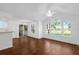 Open concept living area featuring hardwood floors, large windows, and sliding door access at 1013 S Hiawassee Rd # 3628, Orlando, FL 32835